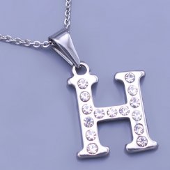 Písmeno H se zirkony z chirurgické oceli