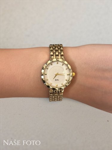 Zlaté dámské hodinky s reliéfním ciferníkem